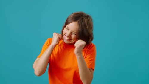 Young Woman Watches Raffle or Sports Match Excitedly