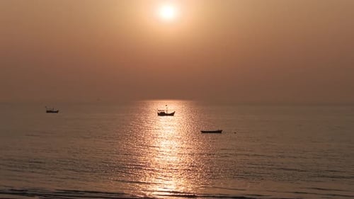 serene, wide-angle shot of a calm sea bathed in the monochromatic bronze glow