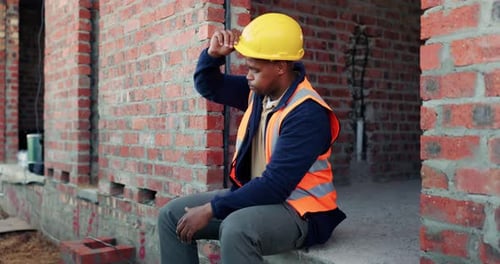 Stress, black man and construction worker with helmet on site with overworked, tired or mistake