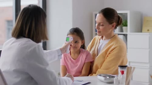 Medicine, Healthcare and Pediatry Concept - Mother with Sick Little Daughter And