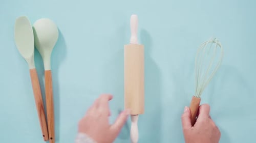 Cooking Tools Arranged on a Blue Surface