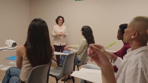 University Professor Teaching a Lesson to a Group of Diverse Students