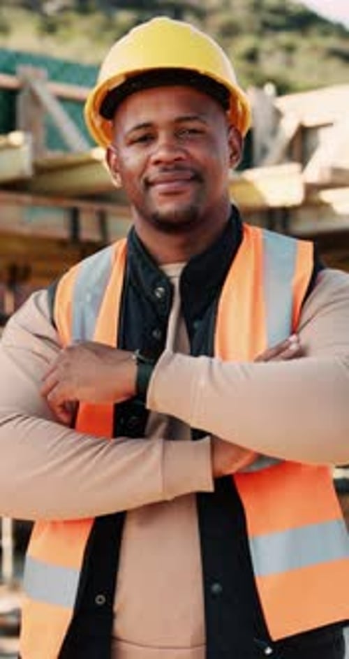 Contractor, face and black man with confidence on construction site for building development