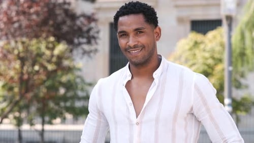 Happy Young Man Smiling While Looking at Camera in City During Daytime