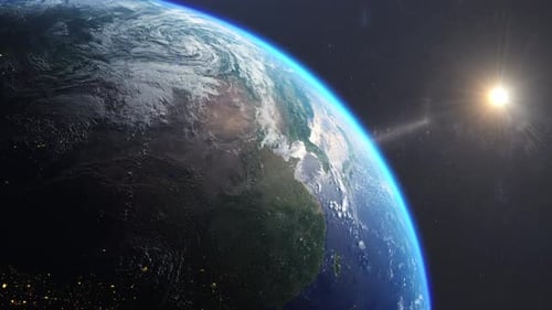 Sunrise over planet earth, cinematic view of part of the globe.Sunlight refraction effects in space.