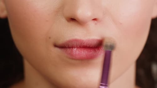 Beauty Shot of Woman Makeup Artist Applying Foundation Bb Cream on Previously Applied Moisturizing