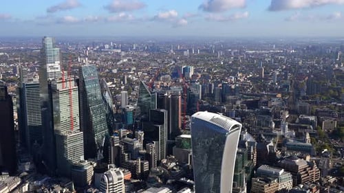 Close up aerial view of the City of London tower cluster, Walkie Talkie building and the river Thame