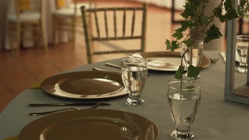 Hall with tables decorated for wedding reception with fresh flowers. Banquet table.