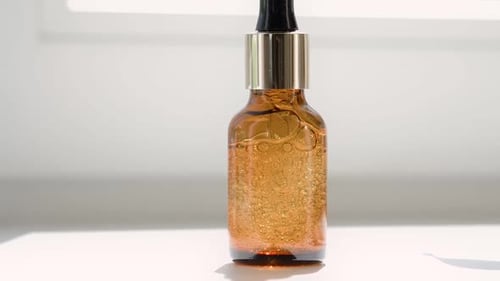Amber Bottle of Luxurious Beauty Serum with Dropper