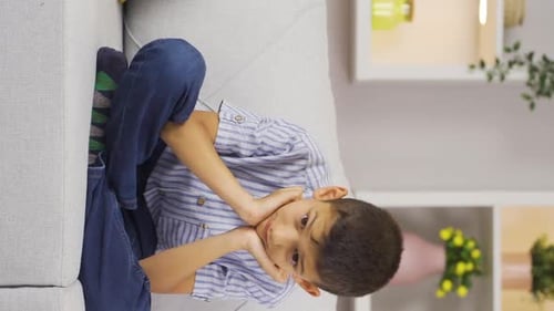 Vertical video of Thoughtful boy.