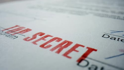 Closeup Sign Top Secret on Private Paper Document. Macro View of Red