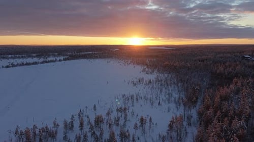 Snow-Covered Lapland Winter Landscape - Aerial In at Sunset