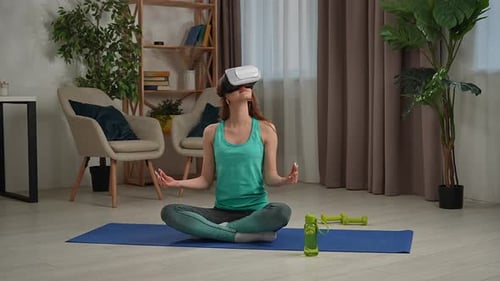 Woman Meditating with VR Headset in Living Room