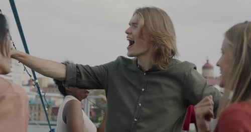 Friends Dancing at a Rooftop Party