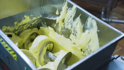 Fresh Butter in a Mixing Machine at a Dairy Factory Food Industry Industrial Production of Butter