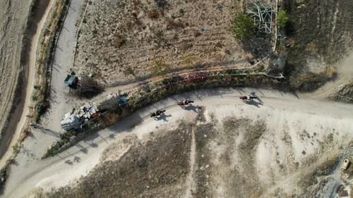 People Riding Horses In The Valley Of Cappadocia Turkey - aerial shot