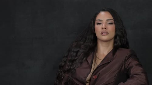 Woman Poses in Fashionable Brown Jacket