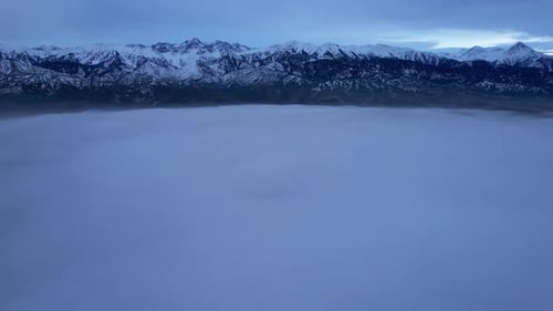 Flying Among the Clouds with a View of Mountains