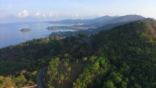 Aerial view of the tropical coastline with beaches and green lush forest. Phuket island, Thailand