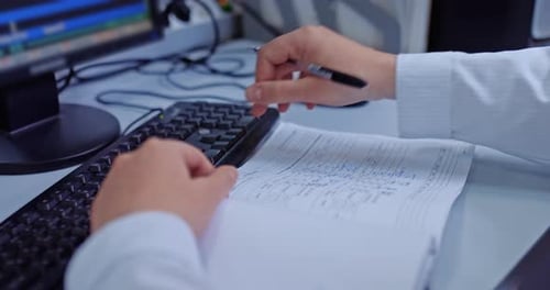 Office Worker Filling Out Project Documentation Closeup of Hands at Table Work with PC Prores
