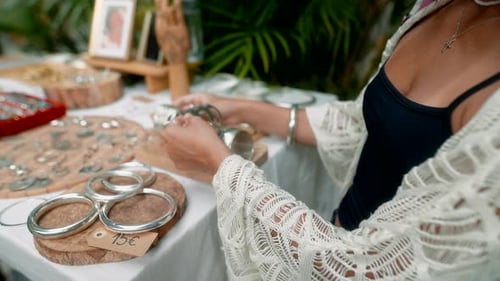 Discovering and Exploring Unique Silver Jewelry Pieces Intricately Crafted at a Market Stall