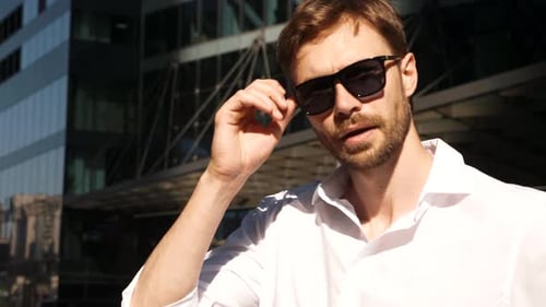 Attractive Man in White Shirt Smiling Downtown