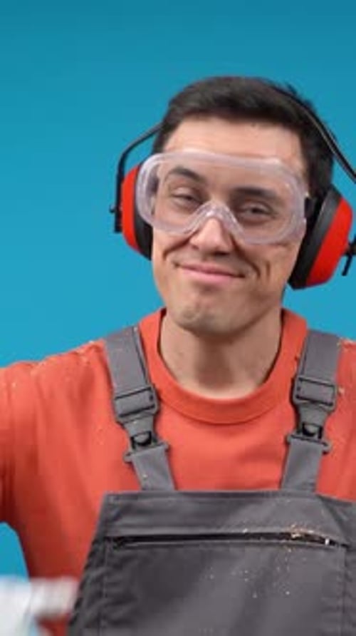 Man Wearing Safety Gear Gives Thumbs Up