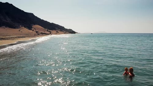 Mother with son at Ligres beach