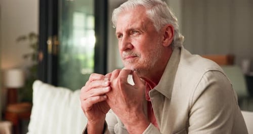 Elderly, man and thinking in home with reflection for memory, retirement or remember marriage