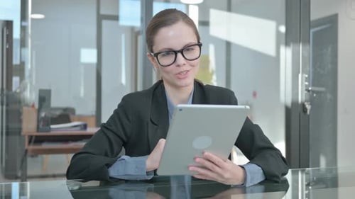 Woman Waving During Video Conference on Tablet