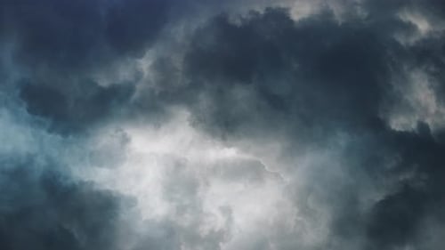 thunderstorms and thick clouds moving in the sky.
