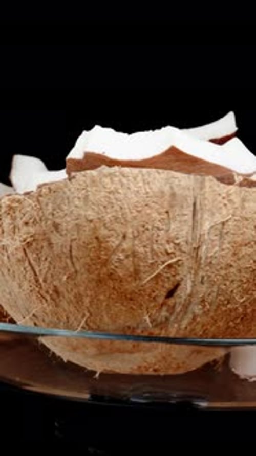 Coconut Halves in Glass Bowl Rotating