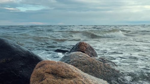 Waves hitting rock. Calm sea waves.