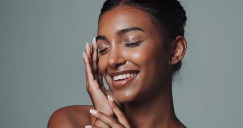 Skincare, face and beauty of happy Indian woman in studio isolated on gray background
