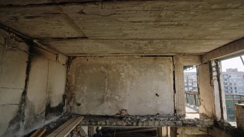 Wardamaged Apartment Shows Collapsed Ceilings Burnt Walls Interior in Ruins Visible Damage From