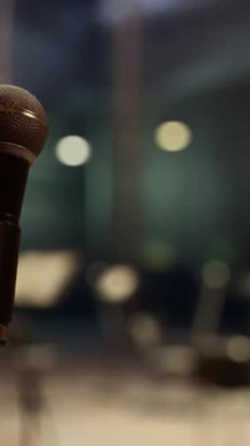 A Microphone That is Sitting in Front of a Music Stand