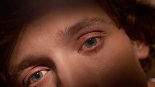 Extreme Close-up Portrait of Young Man with Grey-Blue Eyes and Red Hair