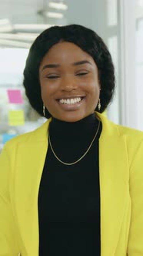 Portrait of Cheerful Afro American Young Business Woman Sitting at Computer Desk in Office Smiling