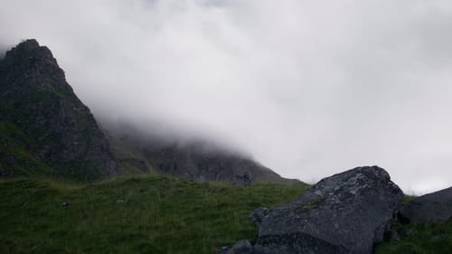 Mountain Peaks Emerging From Clouds in Wilderness