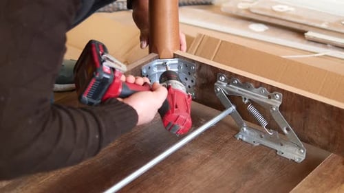 Slow Motion of Using Electric Drilling on Wooden Table