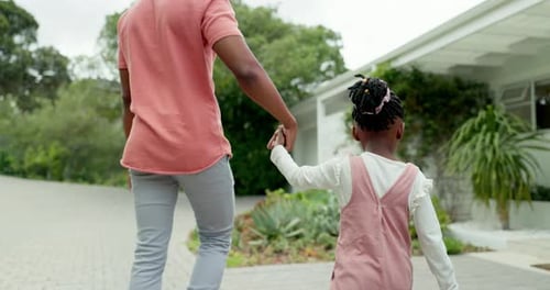 Dad, girl walking and holding hands together at front door, house and coming home from the backyard