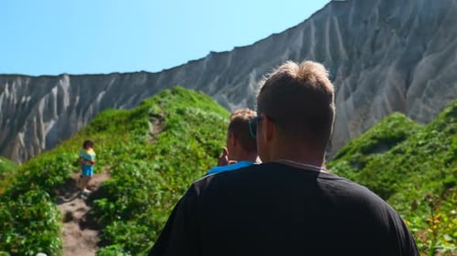 Group of People Walks Along Hiking Trail with Rocks in Summer Clip Beautiful Tourist Route with Path