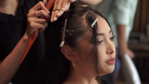 Woman Having Hair Styled at a Salon