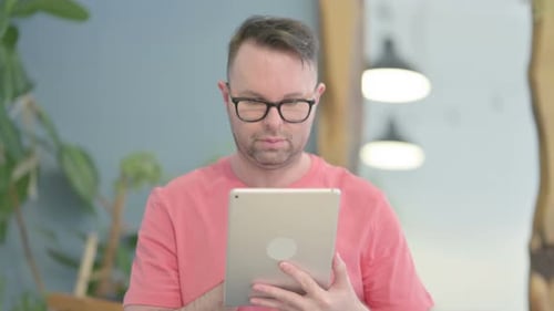 Adult Using Tablet in Bright Home Interior