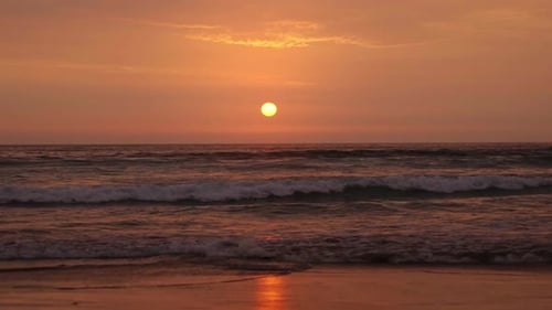 Sunset at the beach and waves