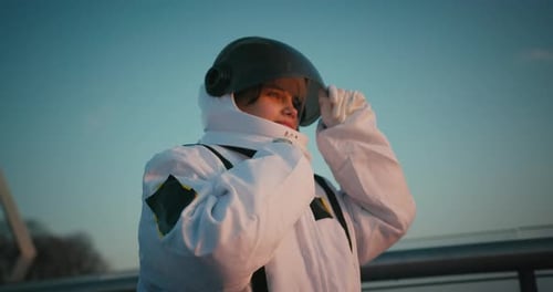 Female Astronaut in Space Suit Opens Helmet Visor Hispanic Woman Cosmonaut Exploring Deep Cosmos