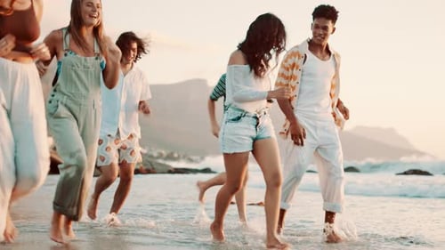 Friends, group or running on beach for bonding with travel, happiness or playing on vacation