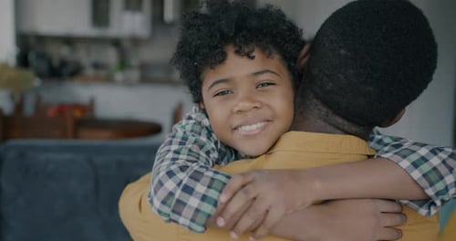 Loving Child Hugs Caring Adult Warmly Indoors