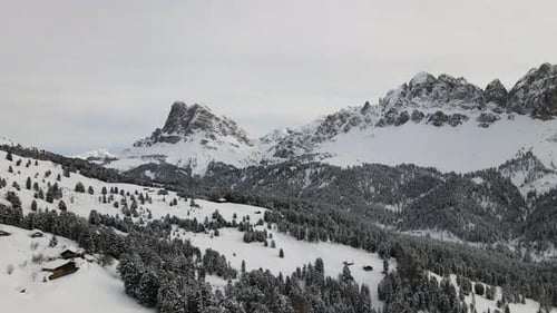 Beautiful Snowy Dolomite Mountains in the middle of the Italian Alps in Winter. Areal Drone Video