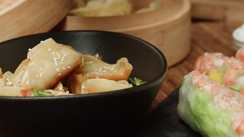 Dimsun Gyoza Dumplings and Spring Rolls on Table Closeup Food Delivery Homemade Dishes